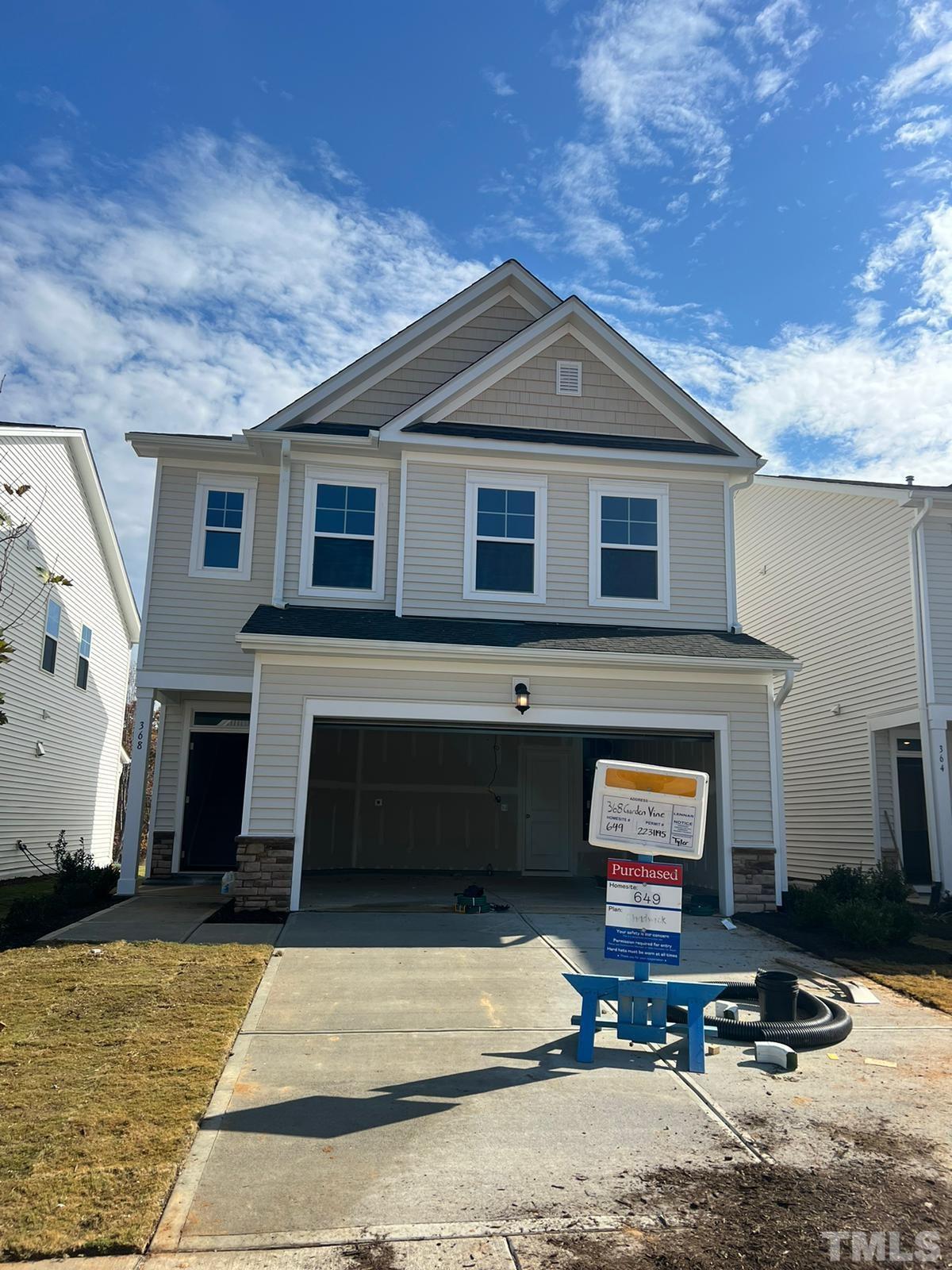 a front view of a house with yard