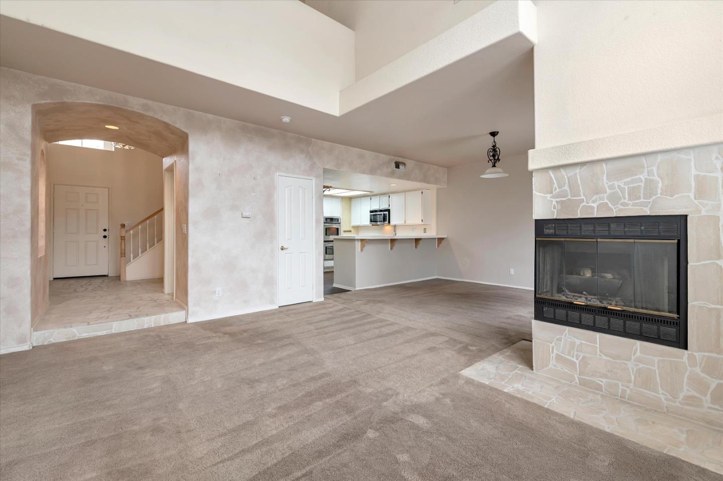 a view of a livingroom and a fireplace