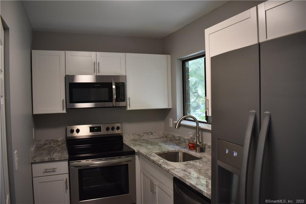 a kitchen with a stove and a microwave