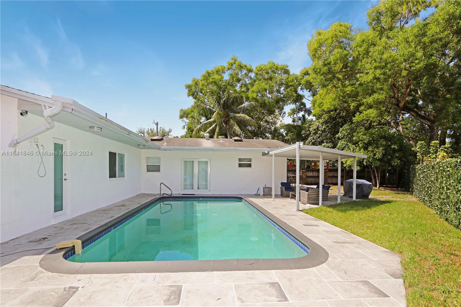 a view of a house with a swimming pool