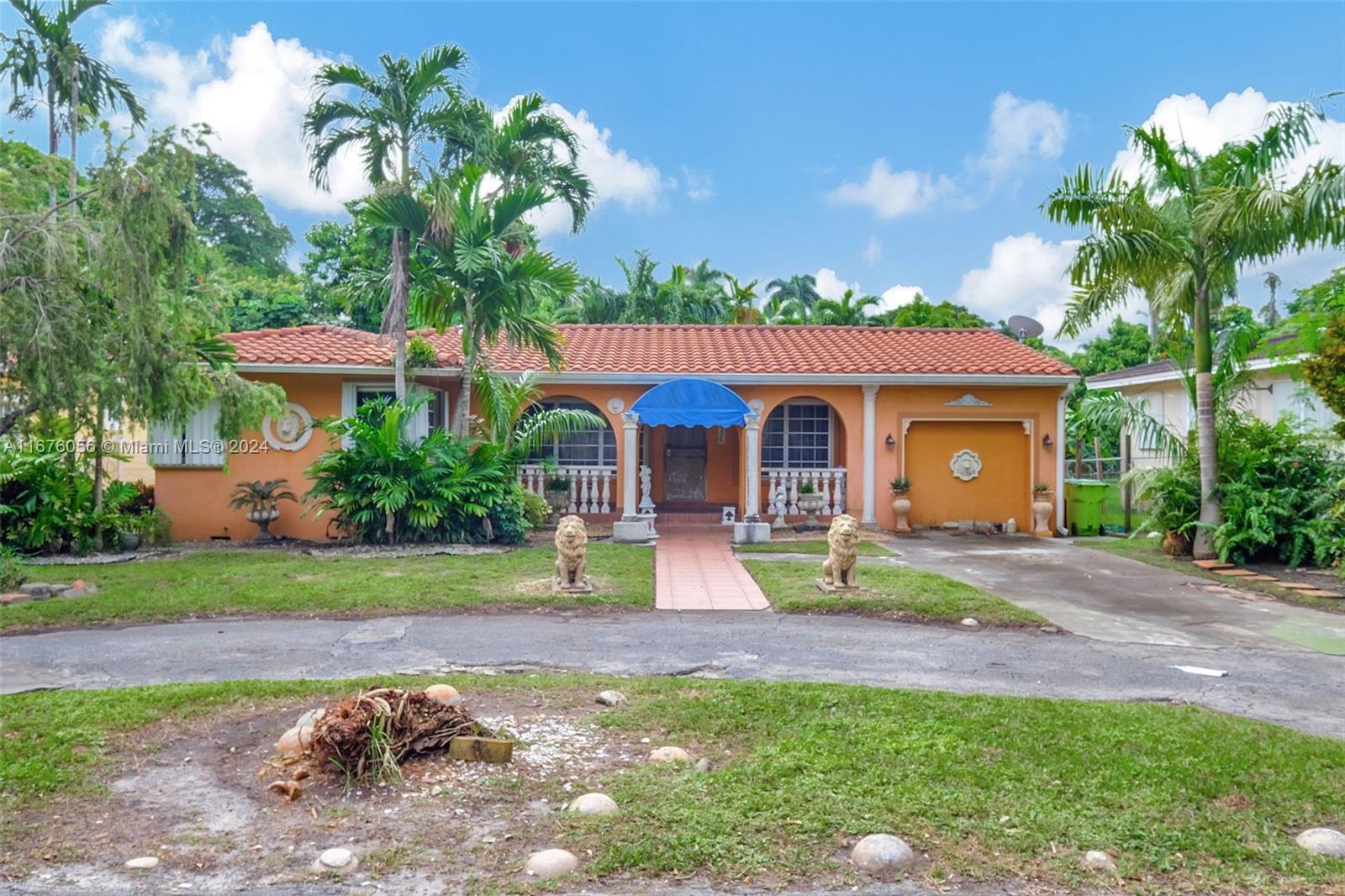 a front view of a house with garden and porch