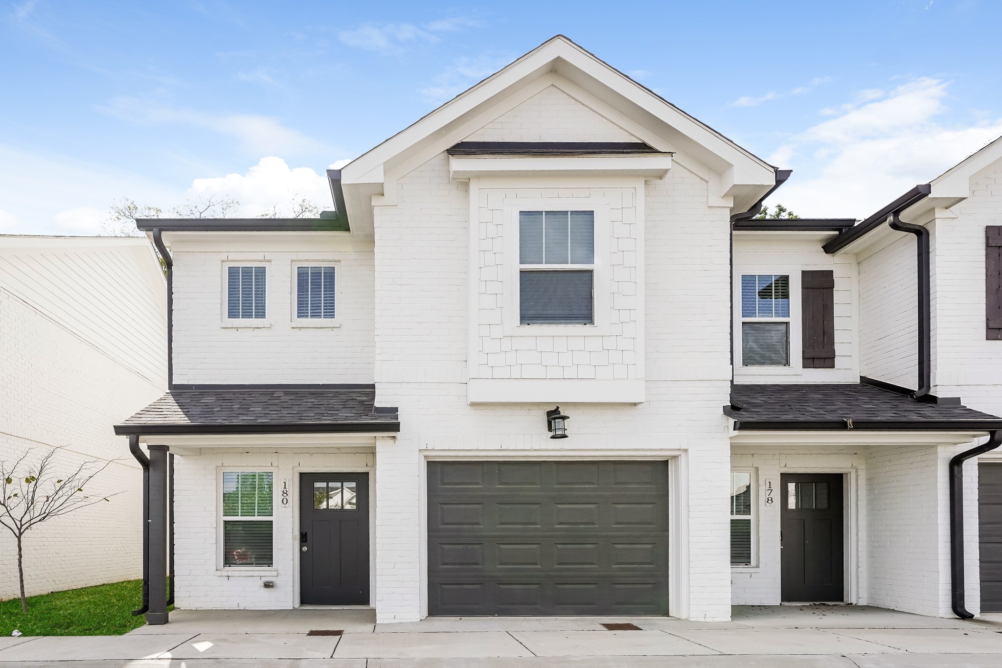 a front view of a house with garage