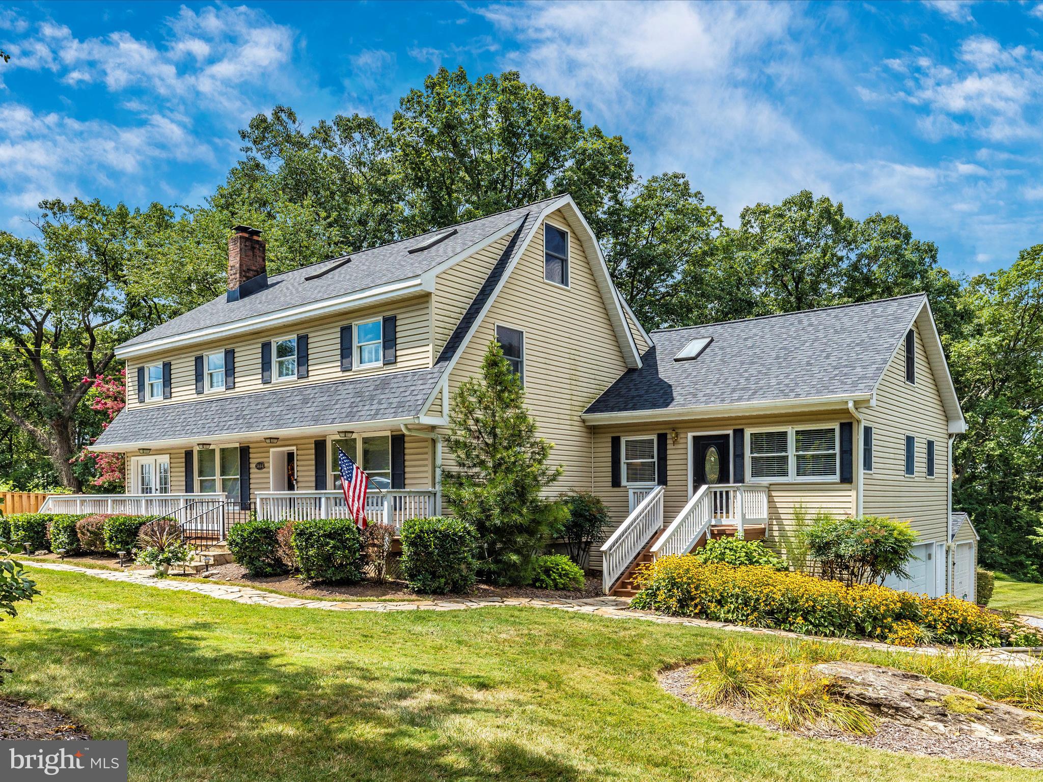 a view of a house with a yard patio and a small yard