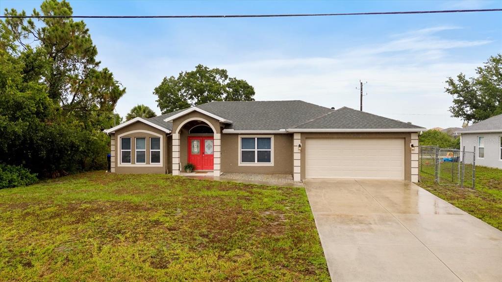 a front view of a house with yard