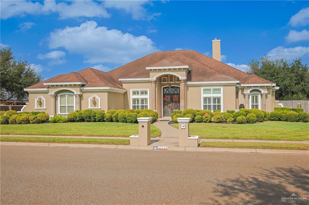 Mediterranean / spanish-style home featuring a front lawn