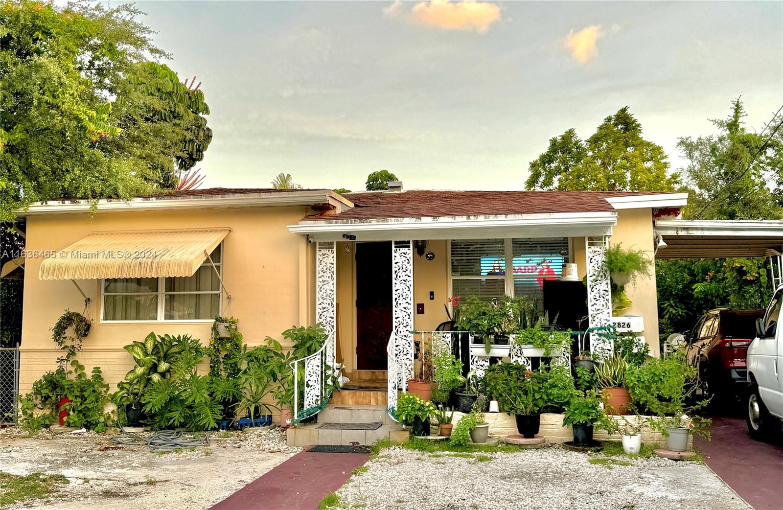 a front view of a house with garden