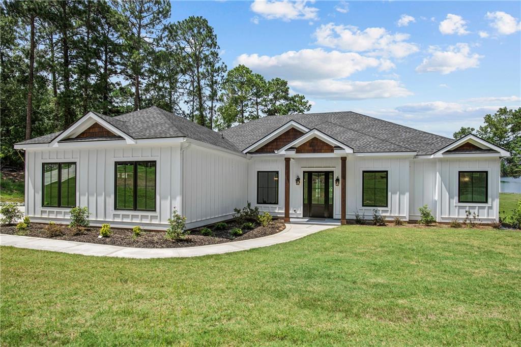 a front view of a house with a yard