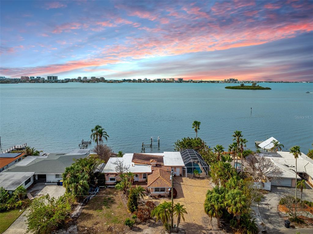 an aerial view of a house with lake view