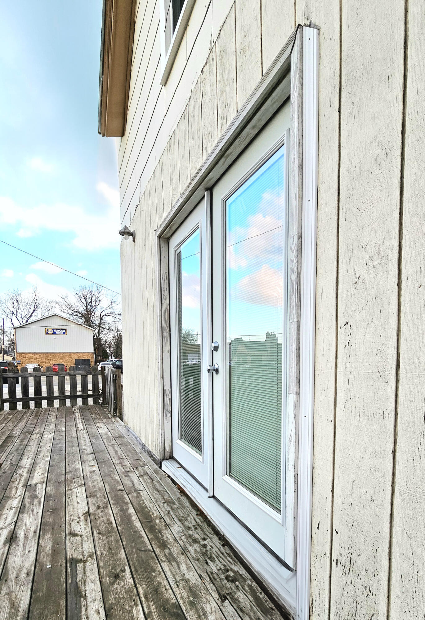 a view of a balcony with wooden floor