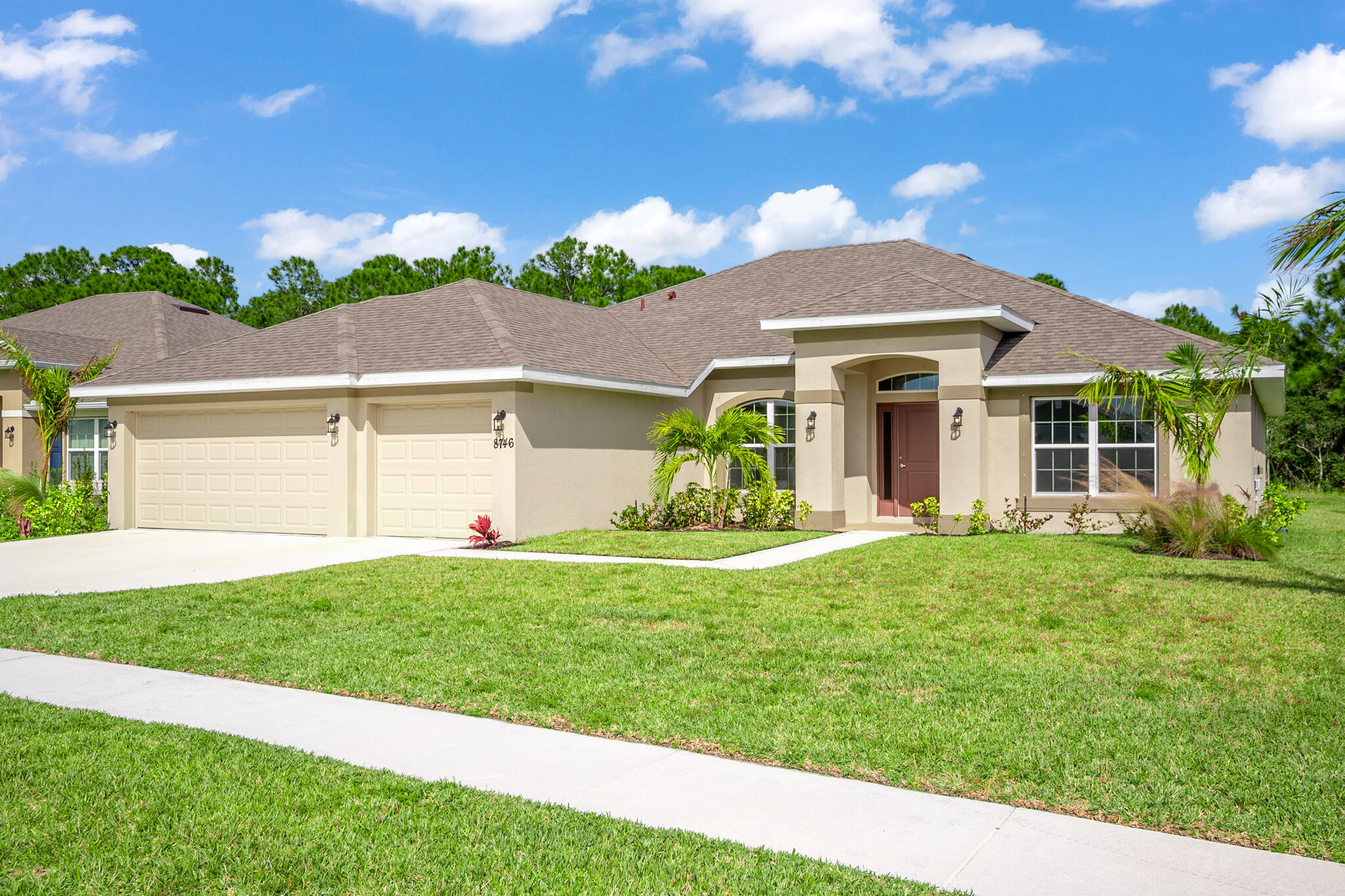 a front view of a house with a yard