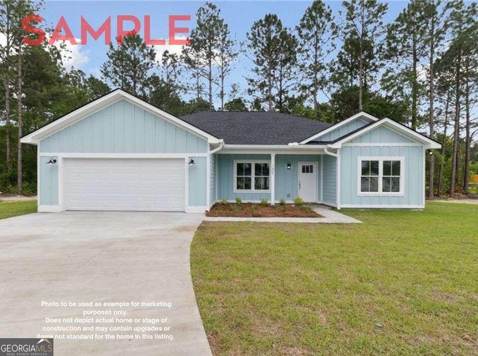 a view of a house with a yard and garage