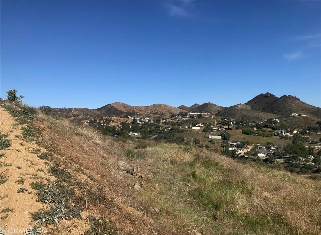 a view of a large mountain with mountains in the background