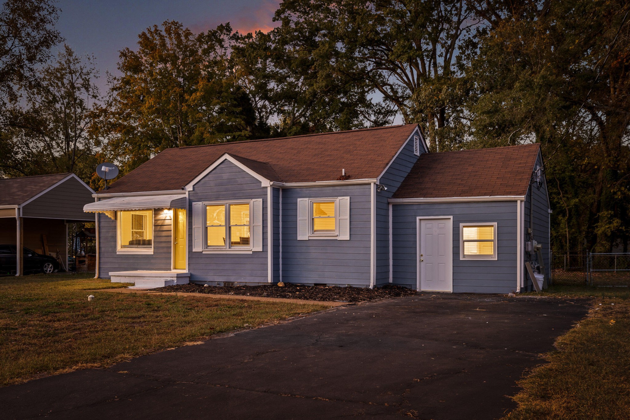 a front view of a house with a yard