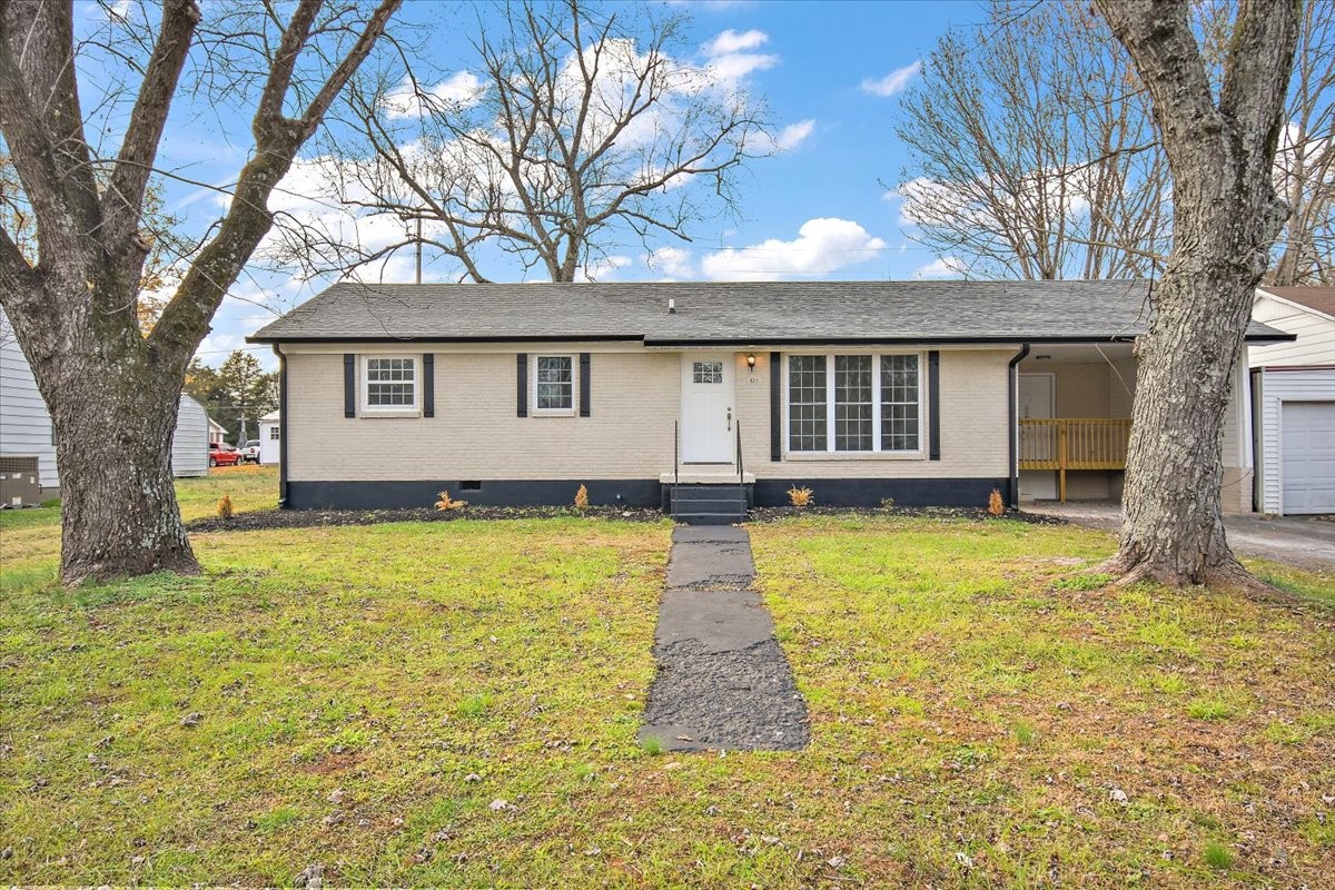 a front view of a house with a yard