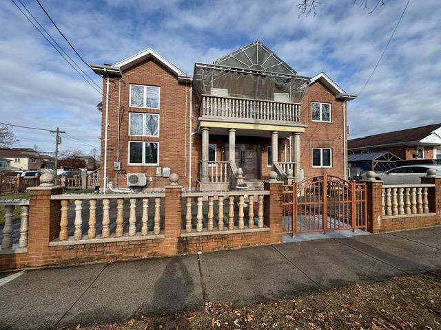 View of front of house with a balcony