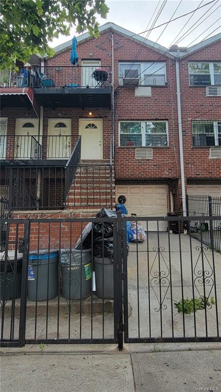 a view of a brick house with many windows