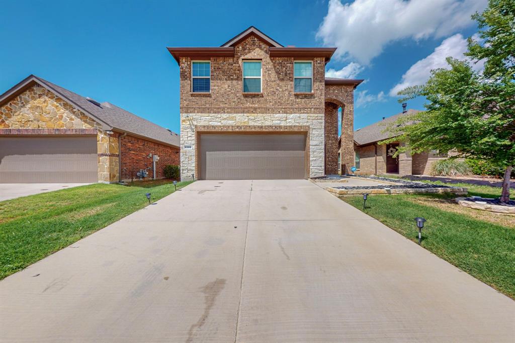 a front view of a house with yard