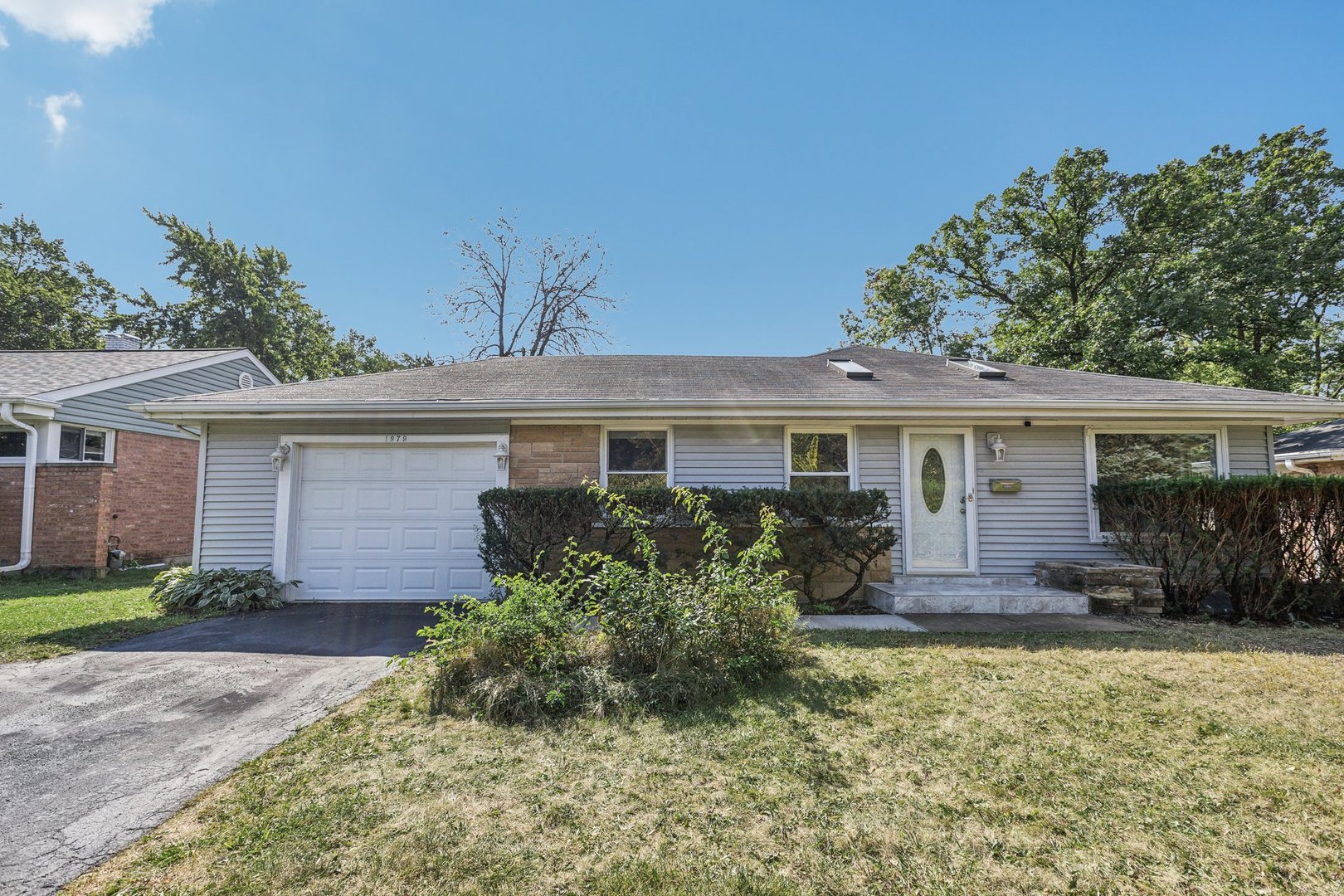 front view of a house with a yard