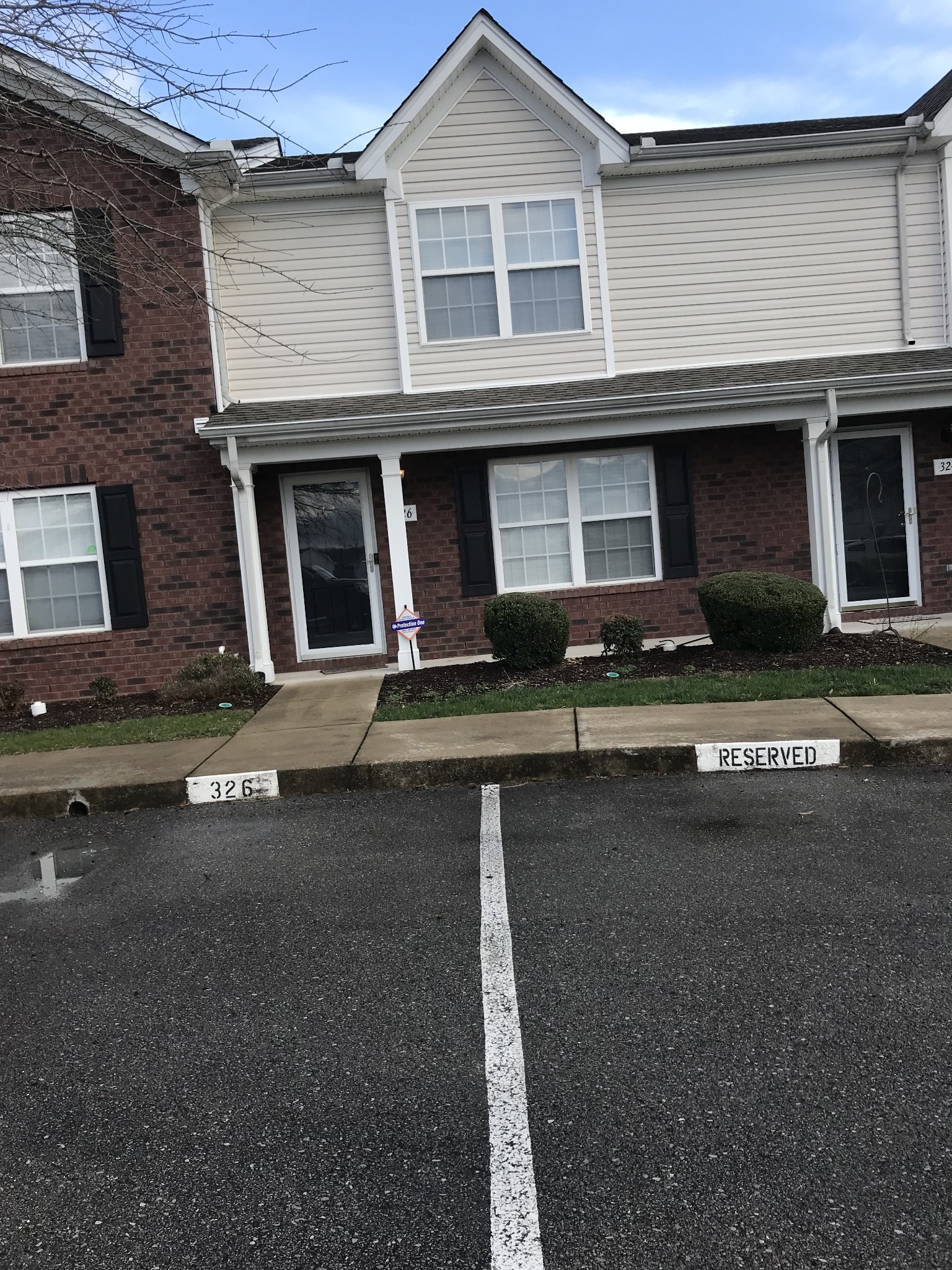 a front view of a house with yard