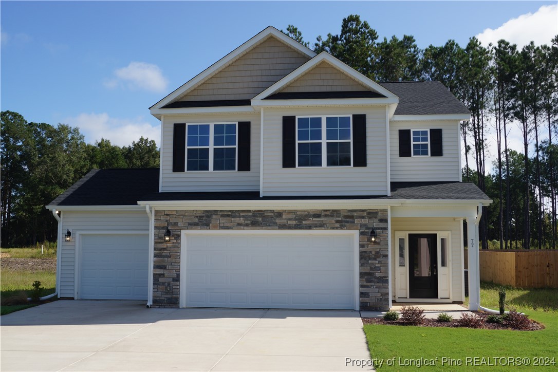 front view of a house with a yard