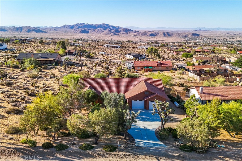 an aerial view of residential houses and trees