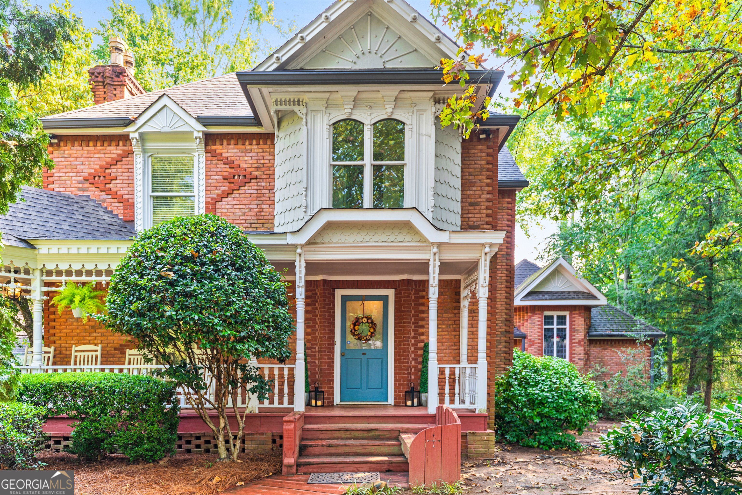 front view of a house with a garden