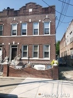 a front view of a building with street view