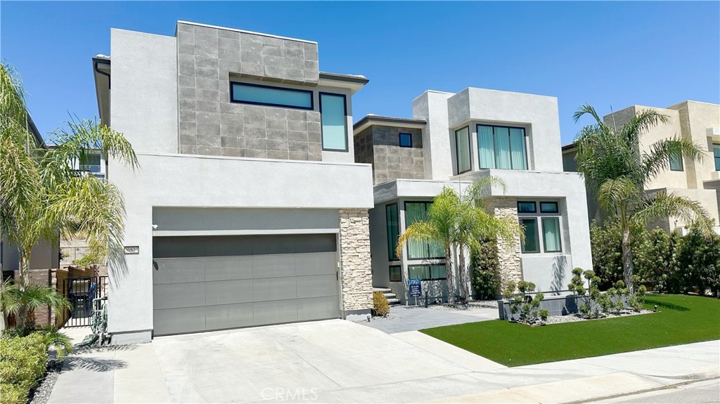 a front view of a house with garage