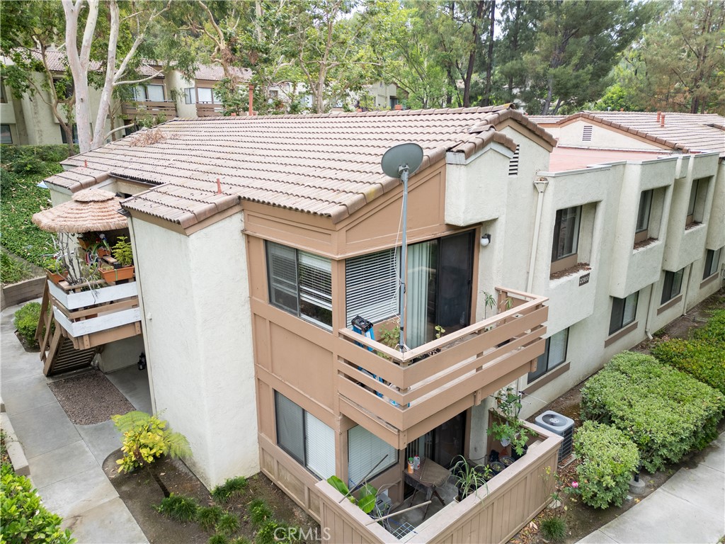 a aerial view of a house with pool and garden