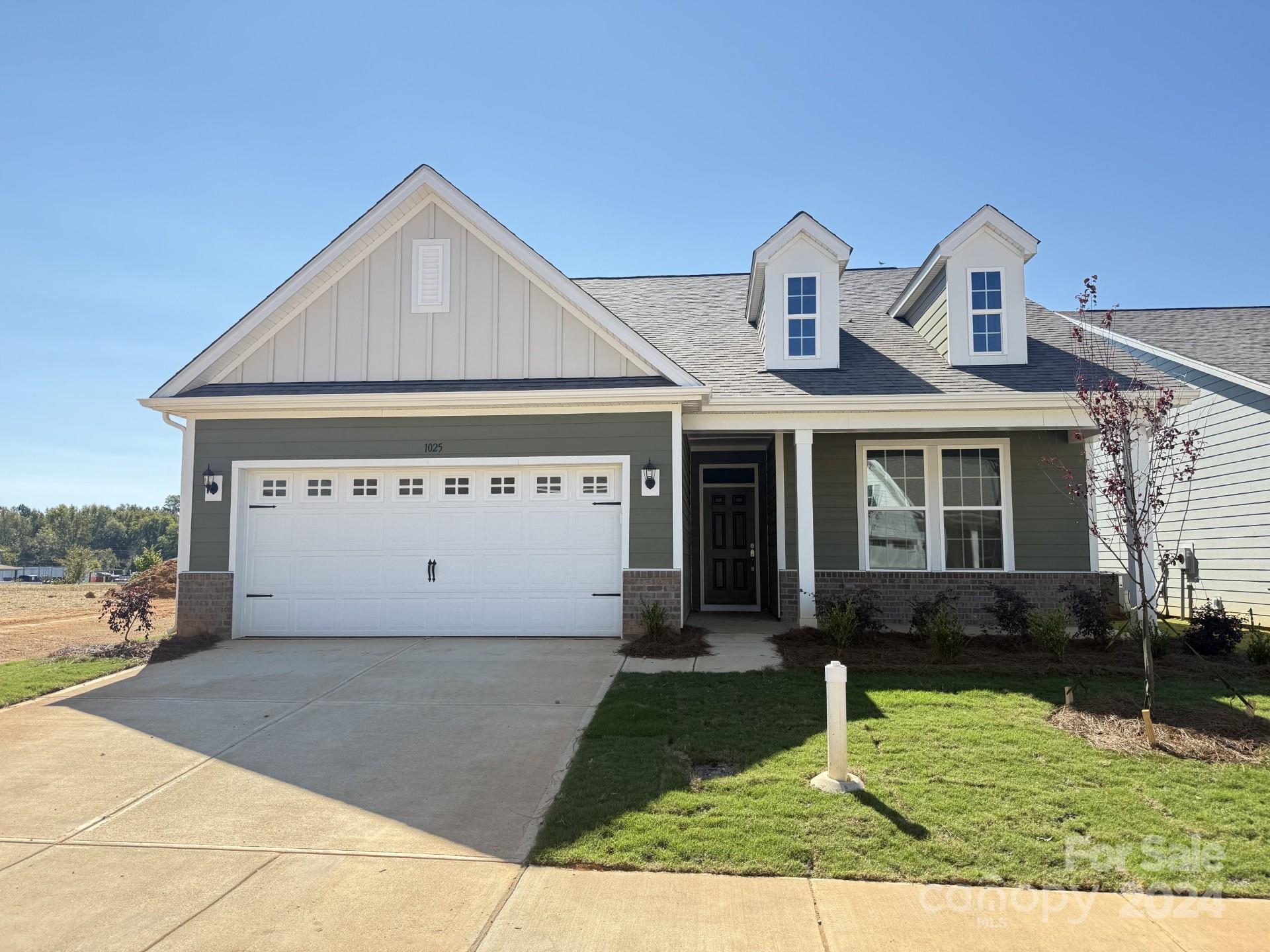 a view of front of house with a yard