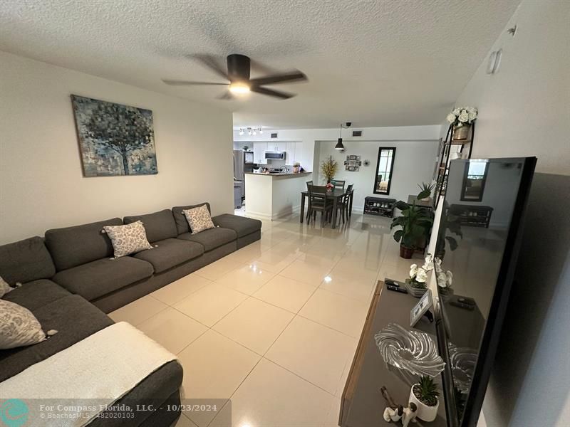 a living room with furniture and a view of living room