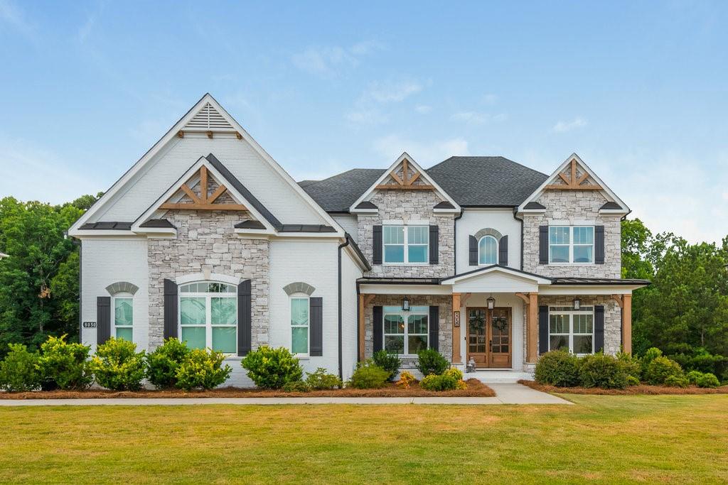 a front view of a house with a yard