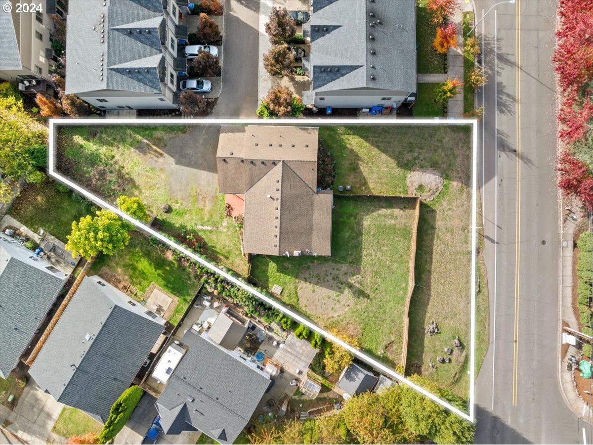 an aerial view of a house with swimming pool