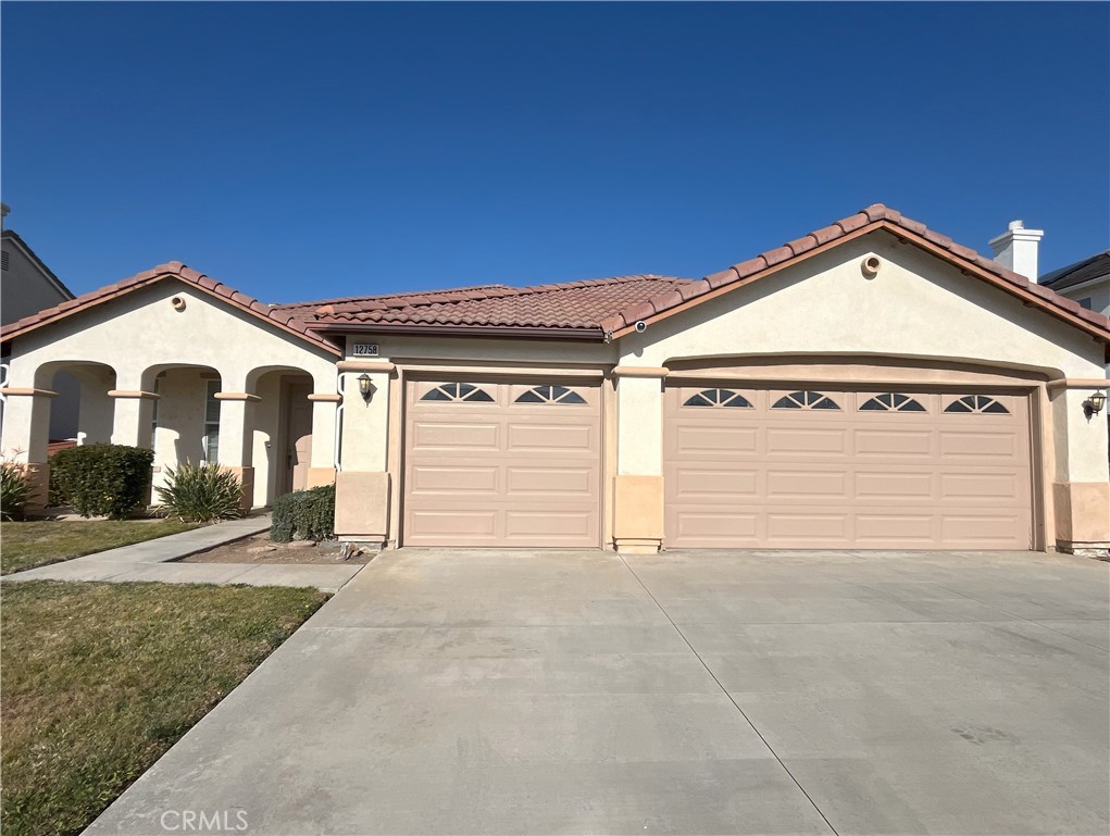 a front view of a house with a garage