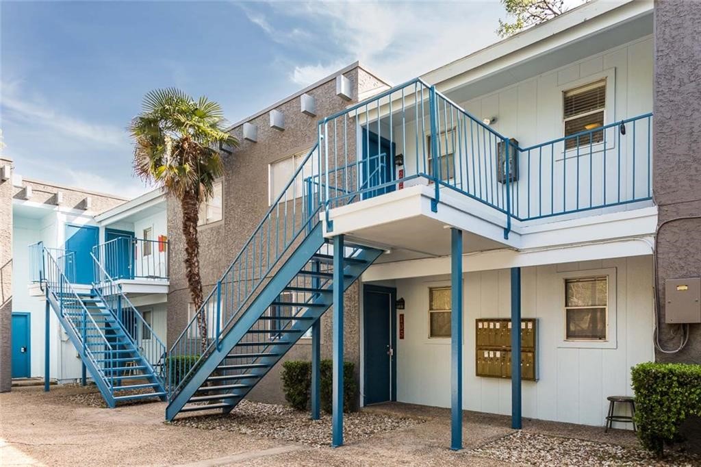 a front view of a house with entryway and stairs