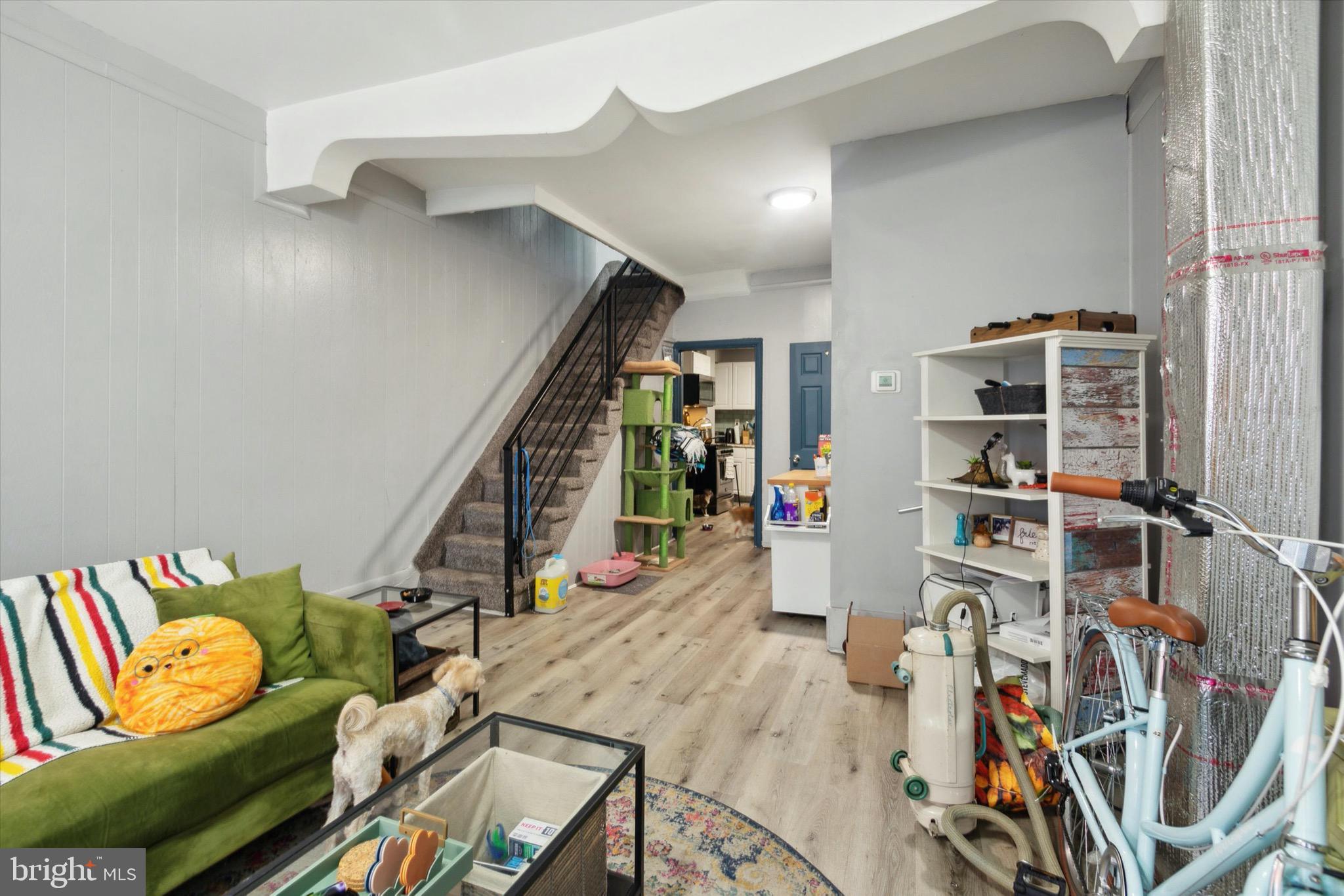 a view of a livingroom with furniture and shoes