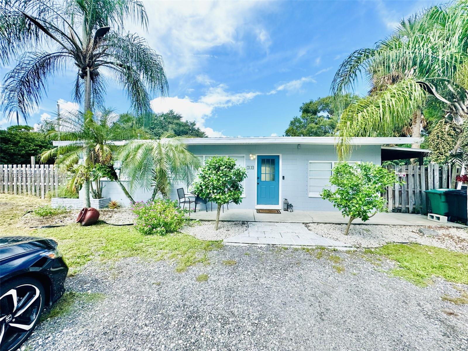 a view of a house with backyard and a slide