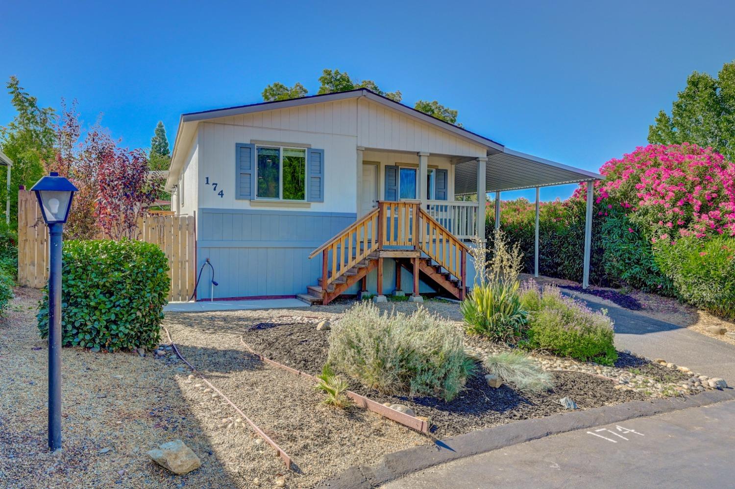 a front view of a house with garden