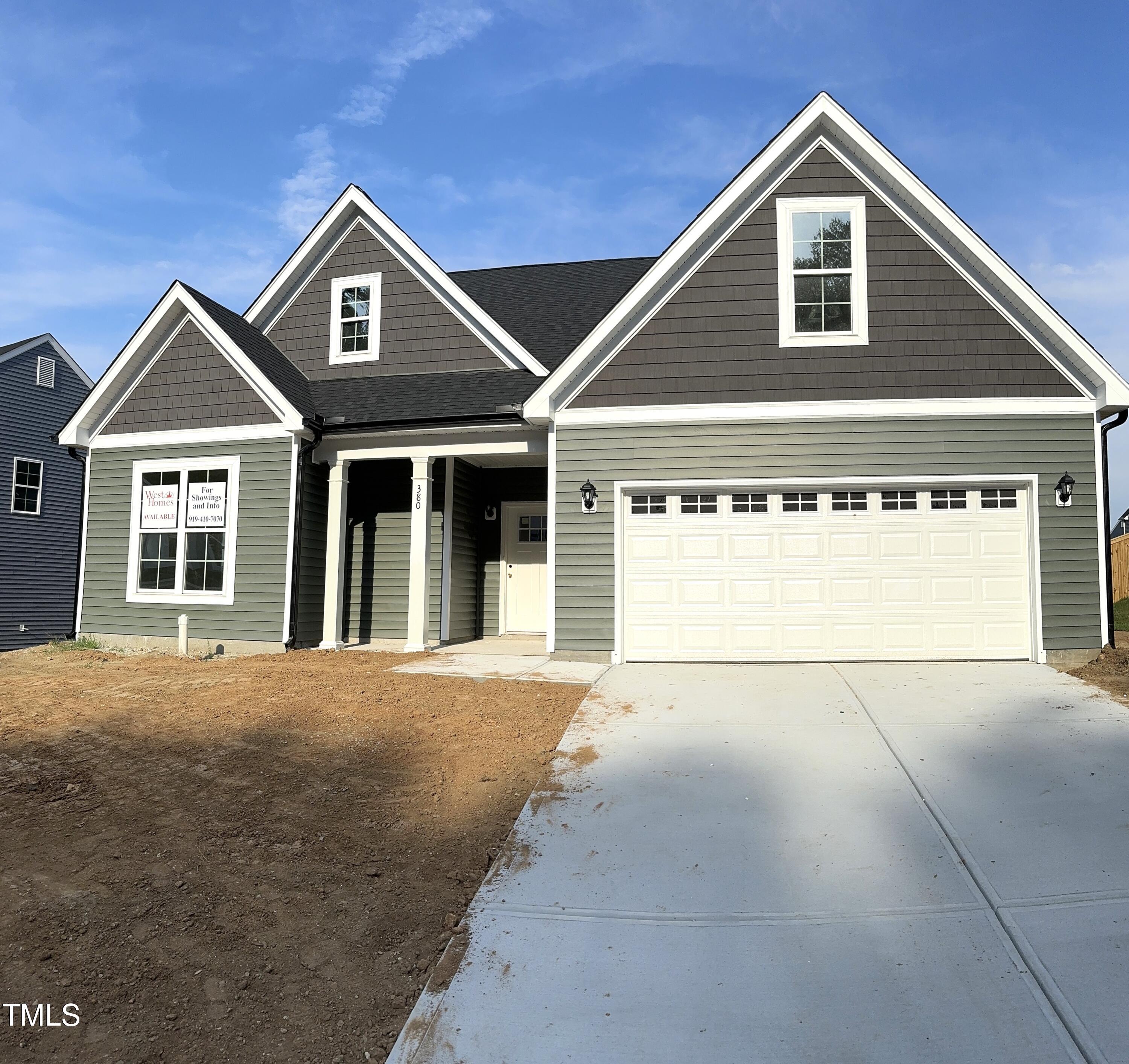 a view of a house with garage