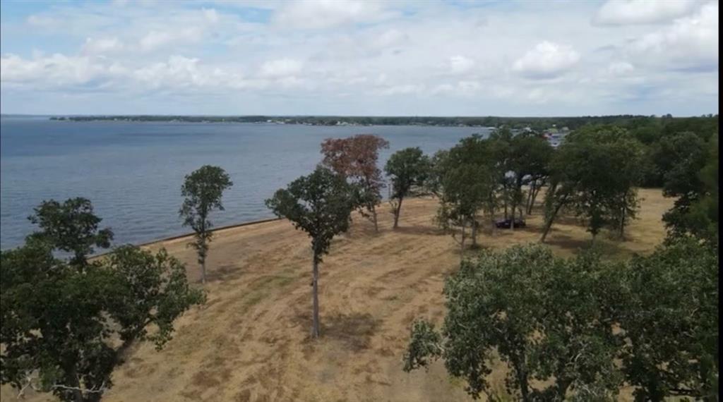 a view of a lake with a yard