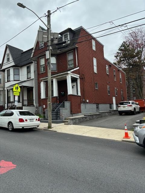 a view of street with parked cars