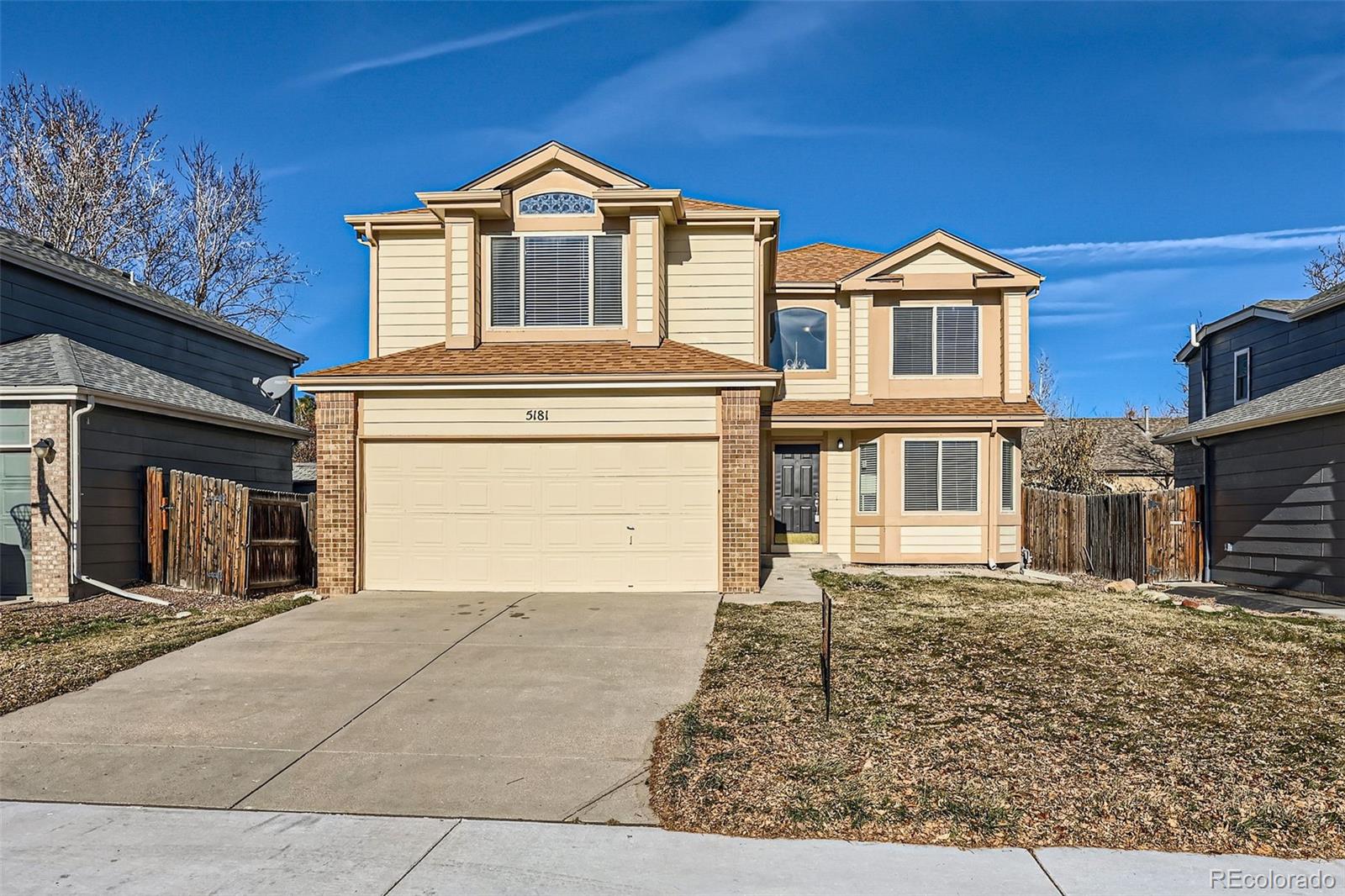 a front view of a house with a yard