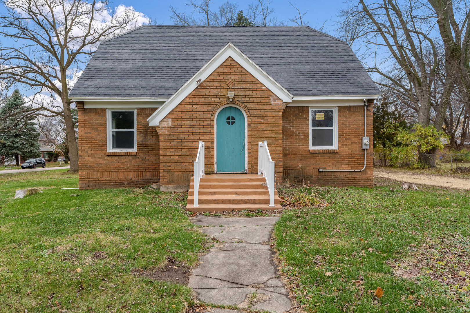 a front view of a house with garden