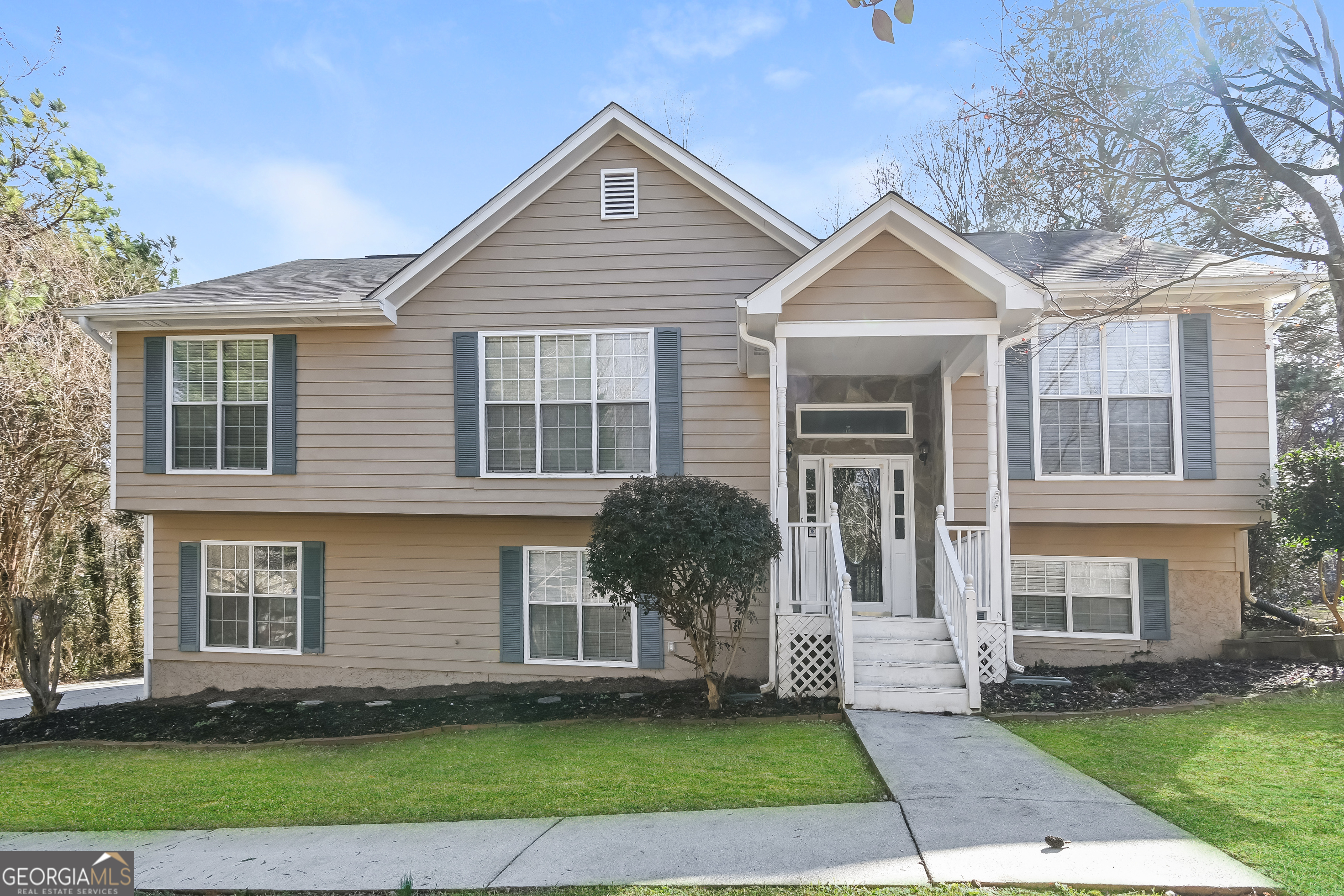 a front view of a house with a yard