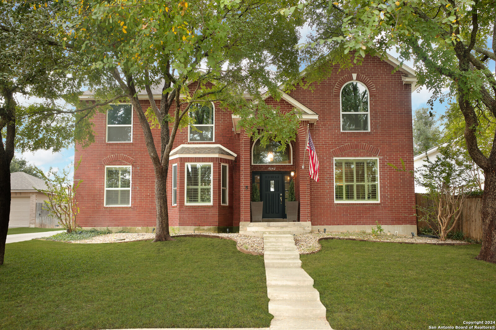 front view of a house with a yard