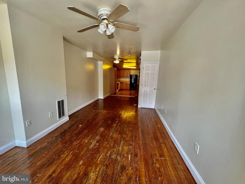 a view of a livingroom with wooden floor