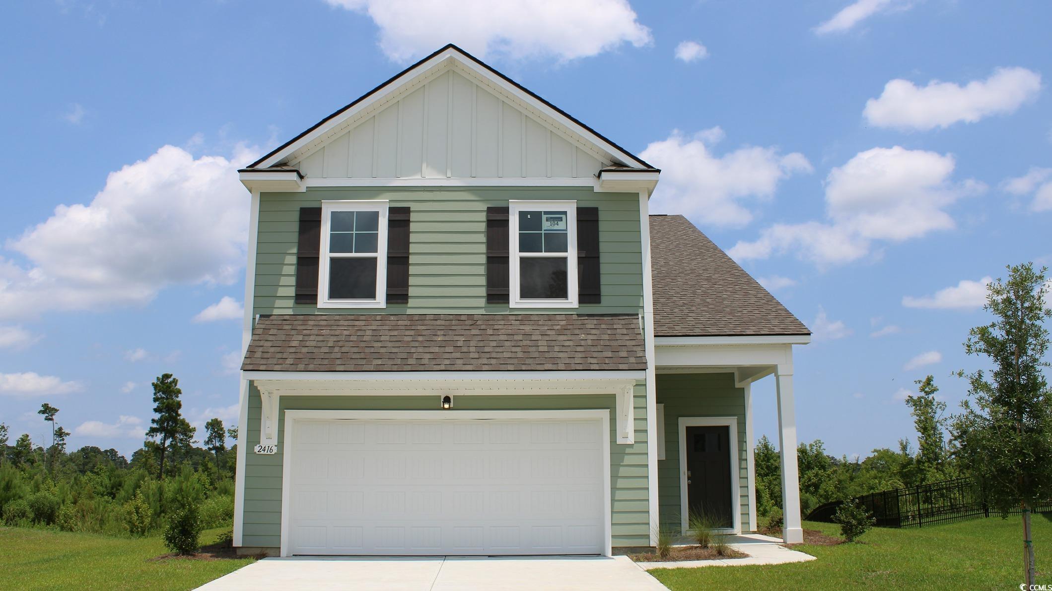 View of front of property featuring a front yard a