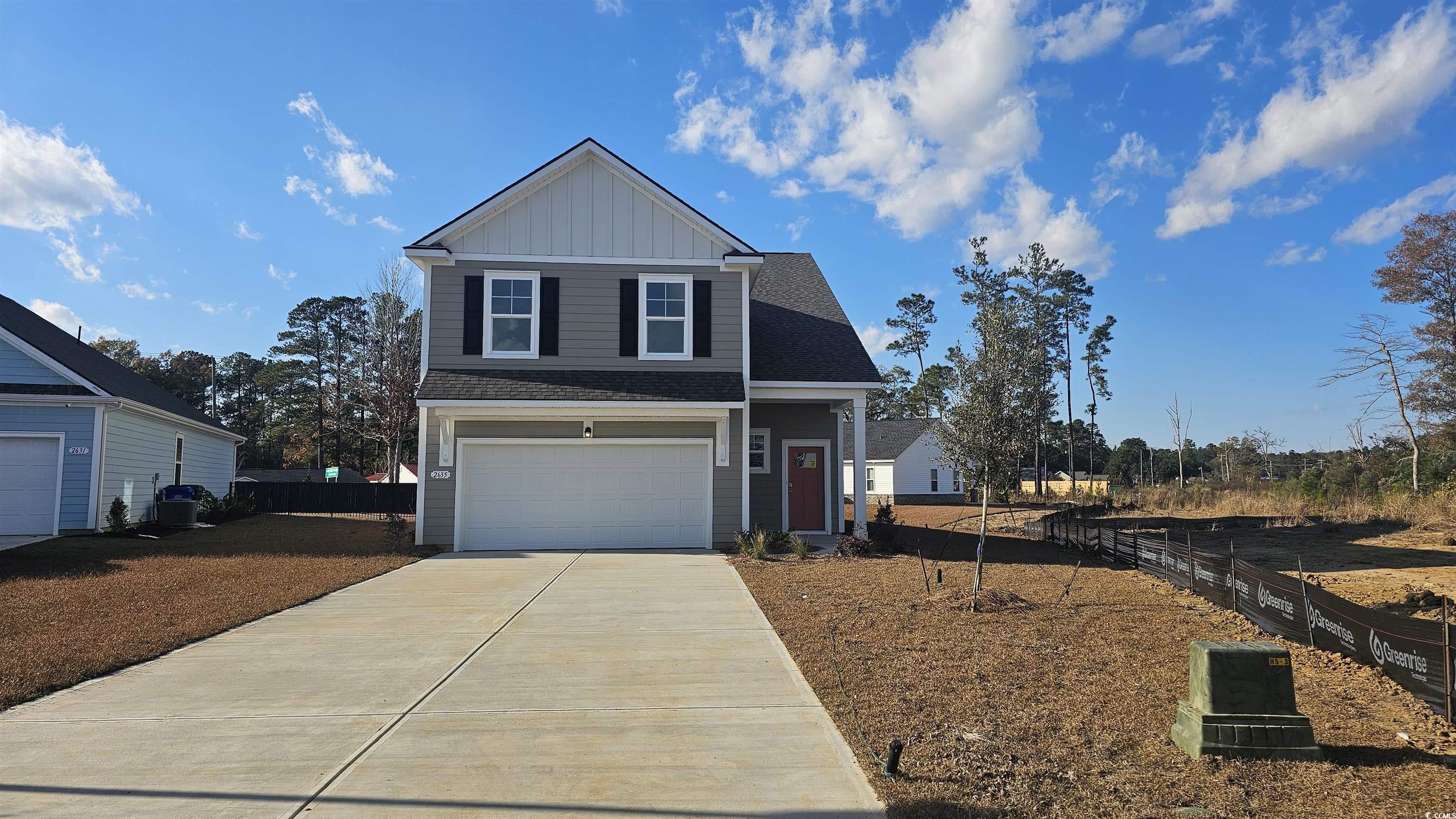 View of front of home featuring a garage