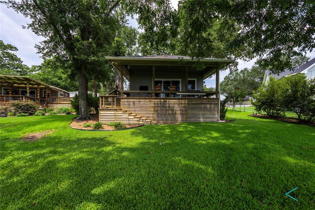 a view of a house with sitting area and garden