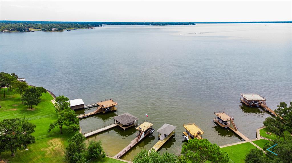 an aerial view of a house with a lake view